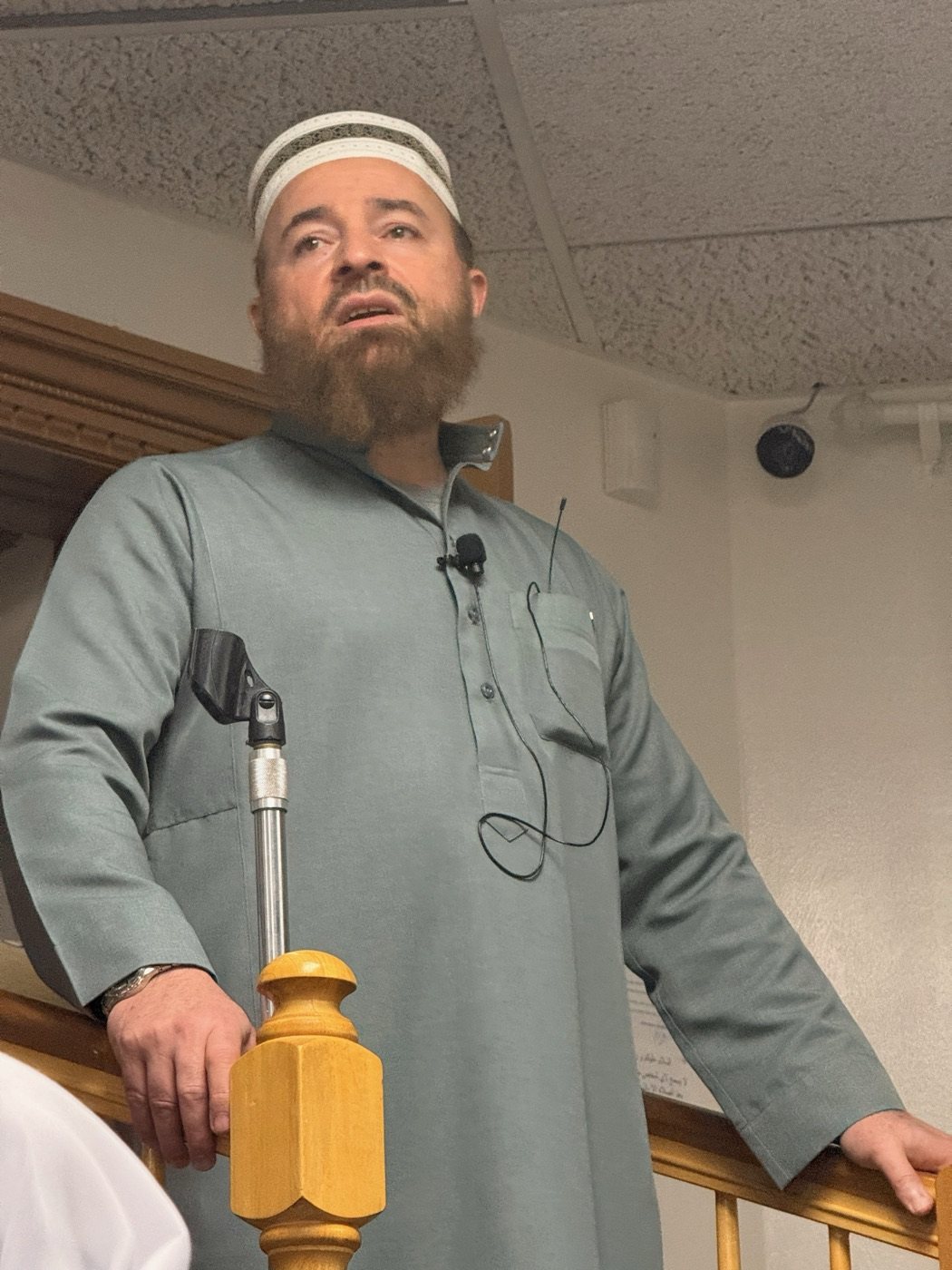 A speaker addressing the Alnur Mosque community
